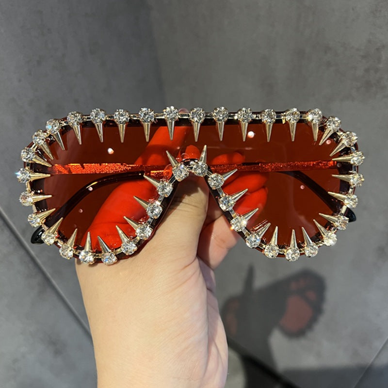 Damen extravagant gestaltete Cat-Eye-Sonnenbrille mit Glitzerakzenten Karnz