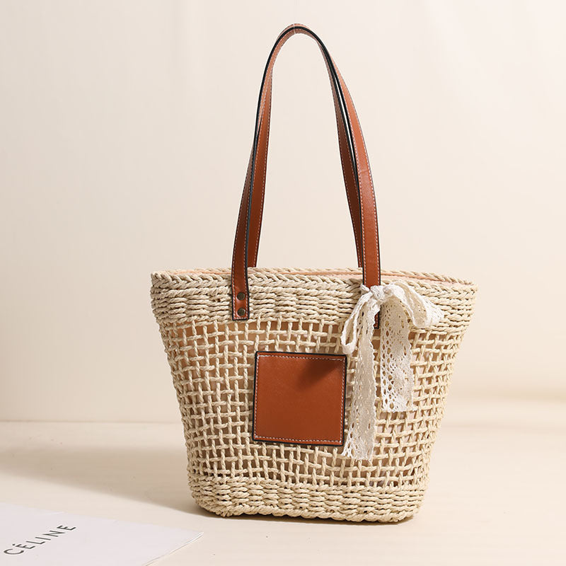 Damen Korbtasche mit eleganten Lederdetails und verspieltem Schleifenakzent Karnz