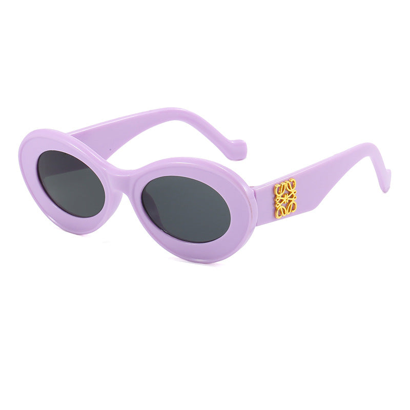 Damen modische Sonnenbrille mit ovalem Rahmen und goldenen Applikationen Karnz