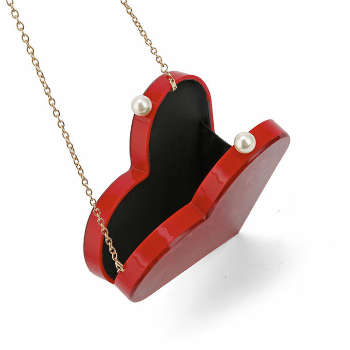 Künstlerische herzförmige Clutch