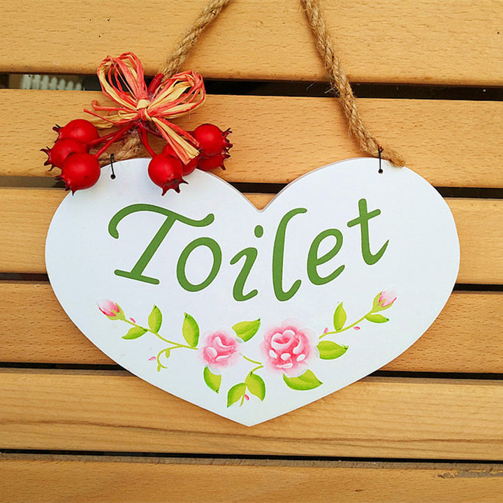 Herzförmiges rustikales Toilettensymbol