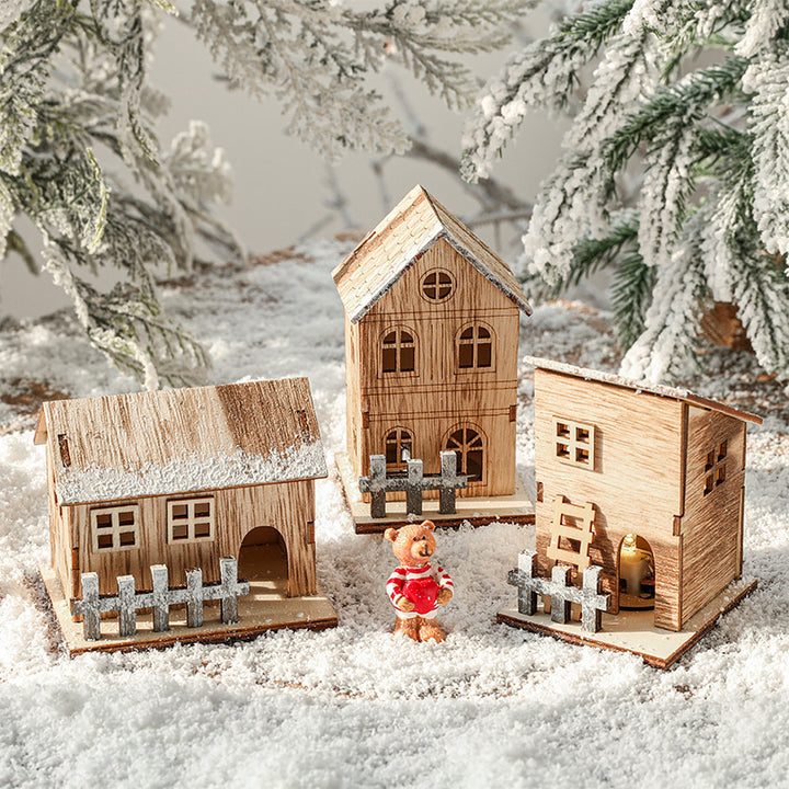 Beleuchtetes Holz-Weihnachtshaus im skandinavischen Stil
