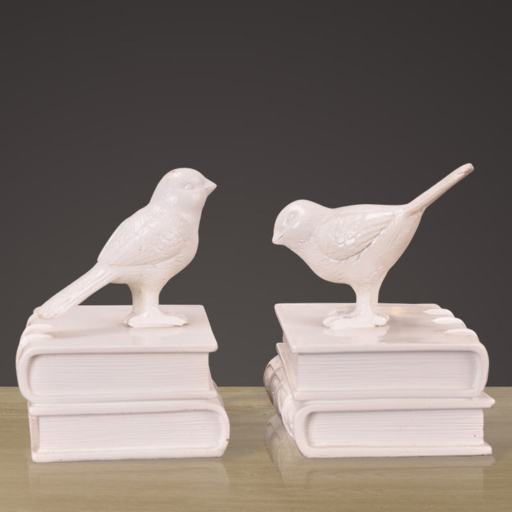 Dekorative Buchstützen mit Vogel-Figuren