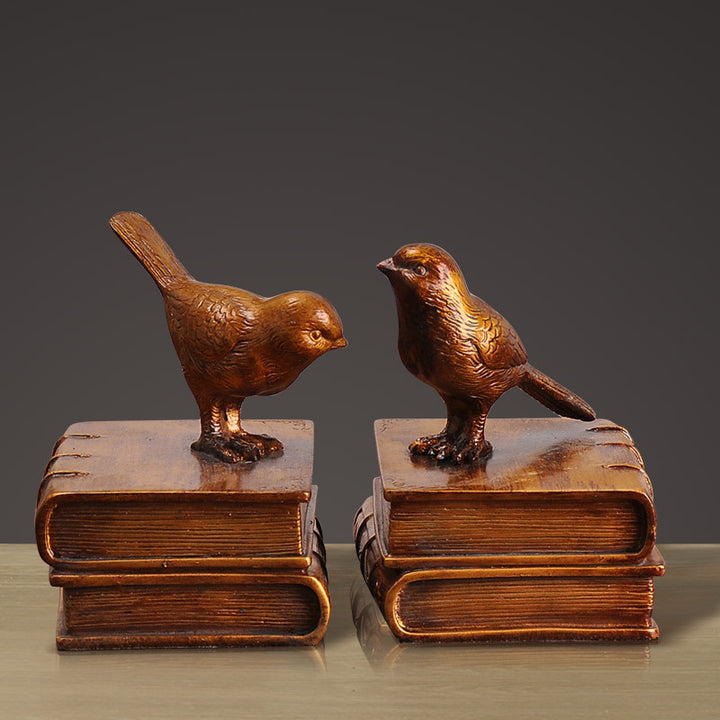 Dekorative Buchstützen mit Vogel-Figuren
