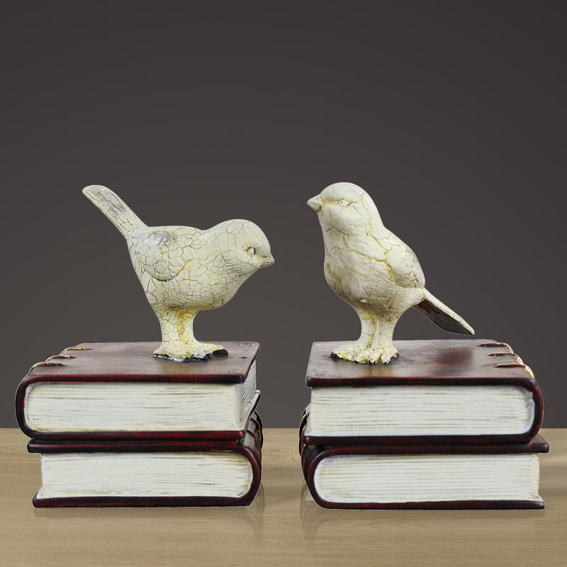 Dekorative Buchstützen mit Vogel-Figuren