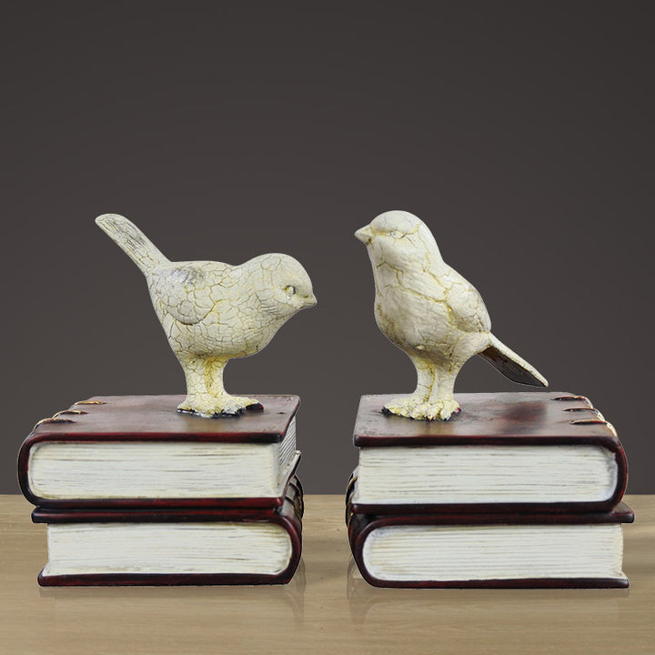 Dekorative Buchstützen mit Vogel-Figuren
