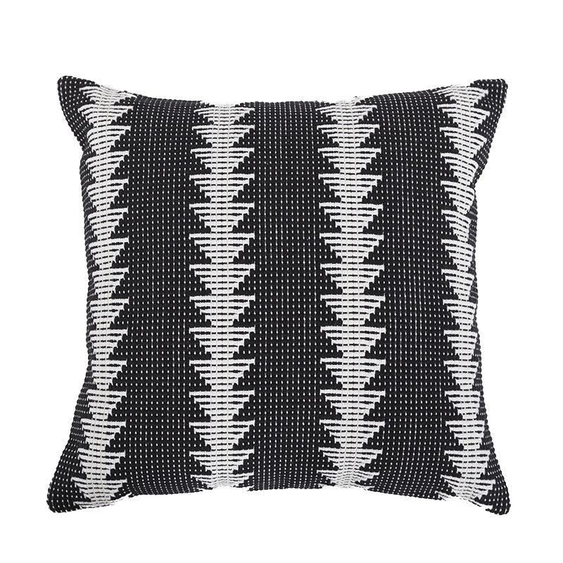 Quadratischer gewebter Zierkissenbezug im Tribal-Jacquard mit Bommel-Ecken