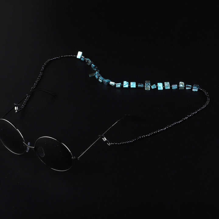 Perlenbrillenhalter mit natürlichen Muschelakzenten Karnz