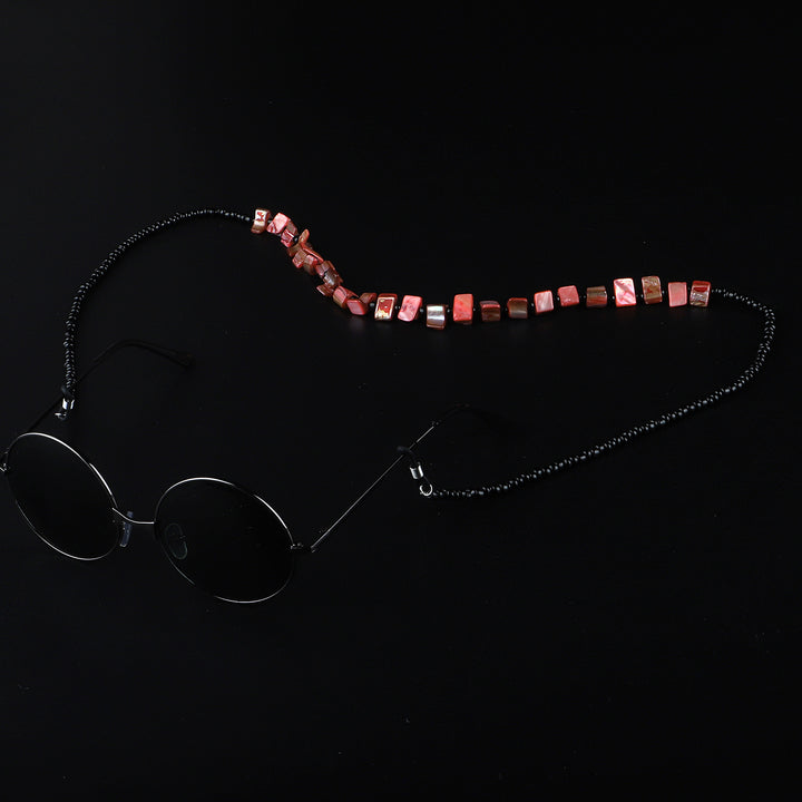 Perlenbrillenhalter mit natürlichen Muschelakzenten Karnz