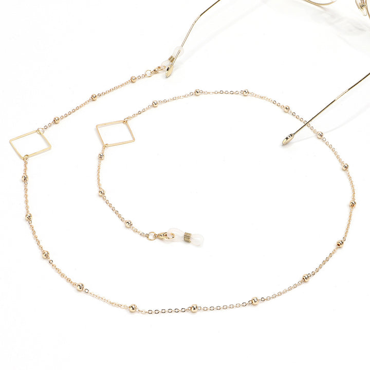 Eleganter goldener Kettenbrillenhalter Karnz