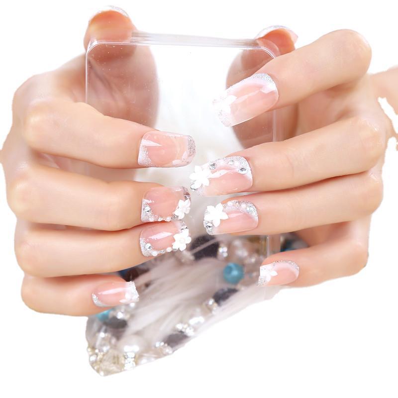 Florales Design Press-On Nail Set mit Strass-Akzenten