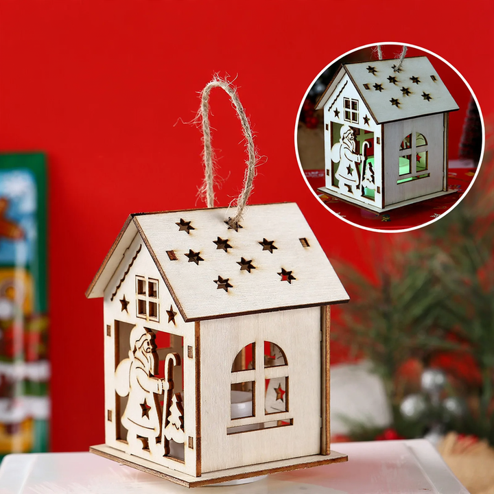 Beleuchtetes Holzhaus als Weihnachtsdekoration