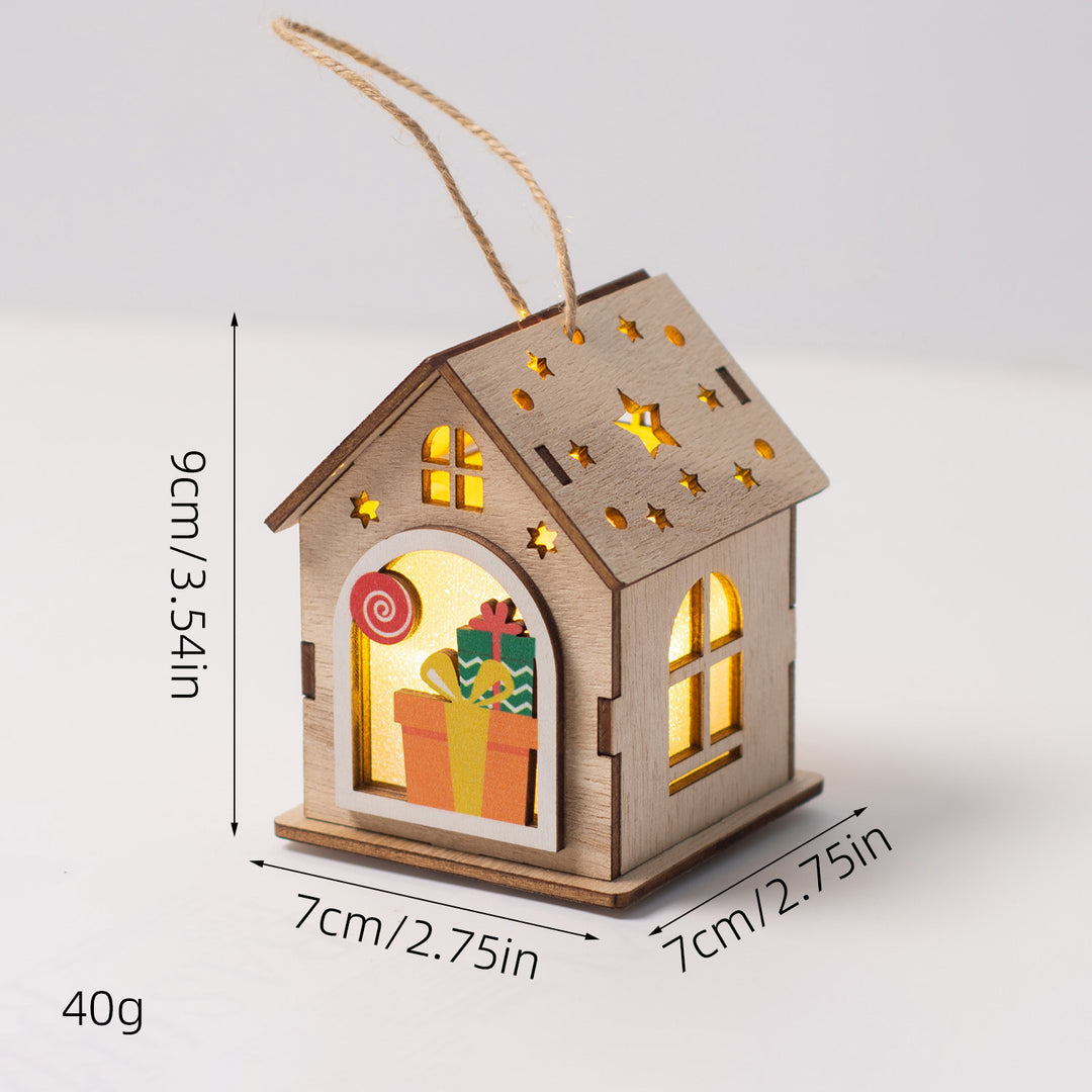 Beleuchtetes Holzhaus als Weihnachtsdekoration