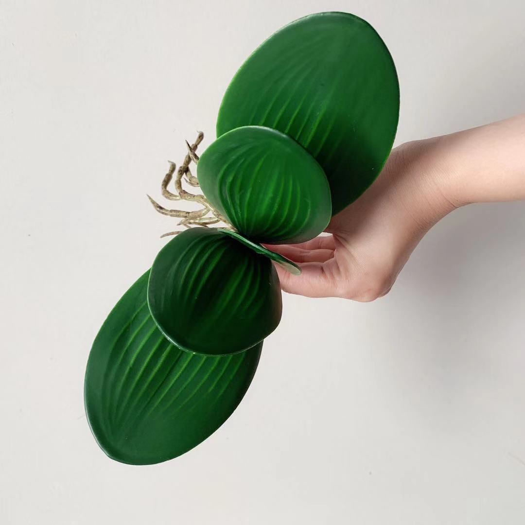 Realistische künstliche Orchideenblatt-Anordnung
