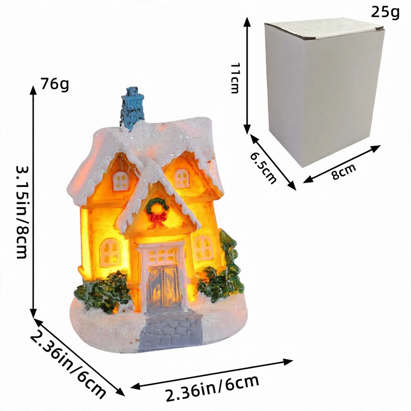 Beleuchtetes Miniatur-Weihnachtshaus mit Schneelandschaft