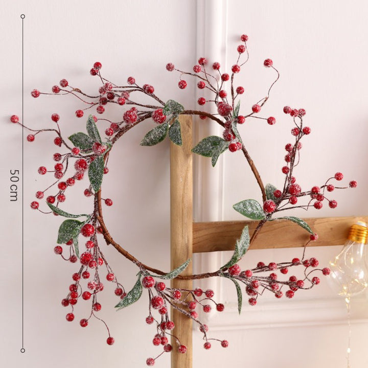 Weihnachtskranz mit roten Beeren