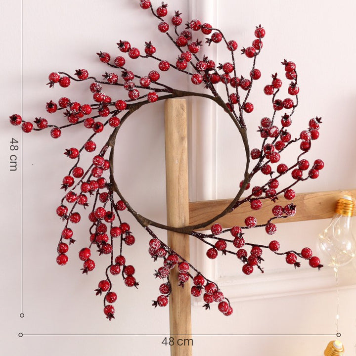 Weihnachtskranz mit Beeren und Früchten