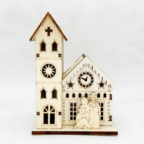 Beleuchtetes Holzhaus zur Weihnachtsdekoration