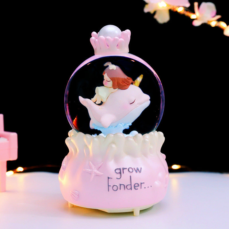 Märchenhafte Schneekugel mit Musik und Licht