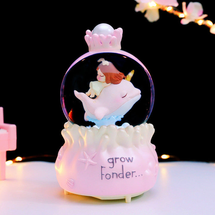 Märchenhafte Schneekugel mit Musik und Licht