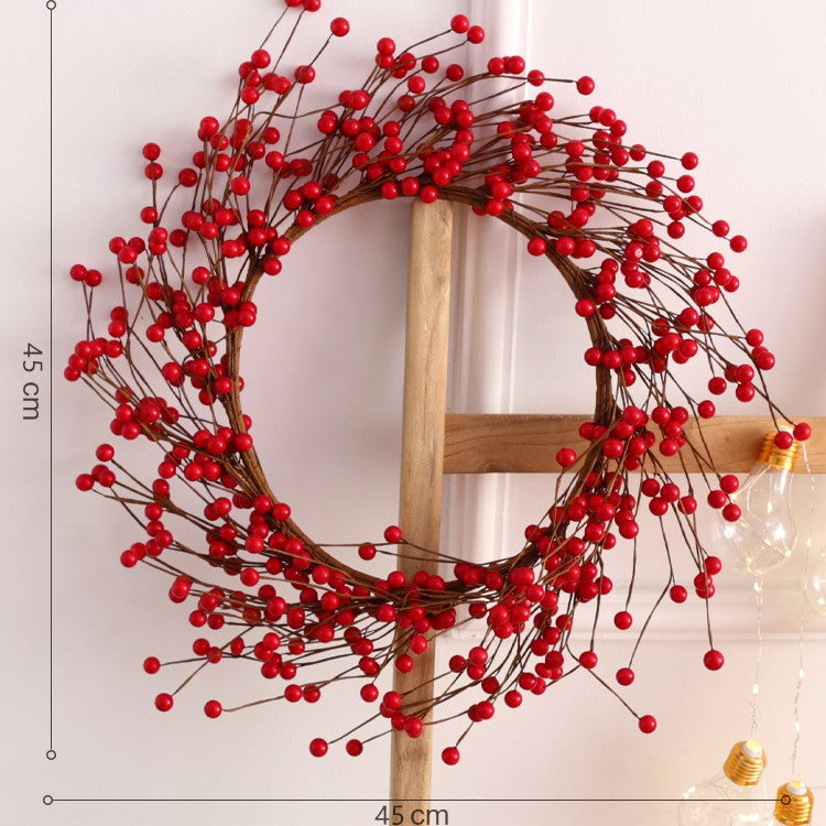 Weihnachtskranz mit Beeren und Früchten