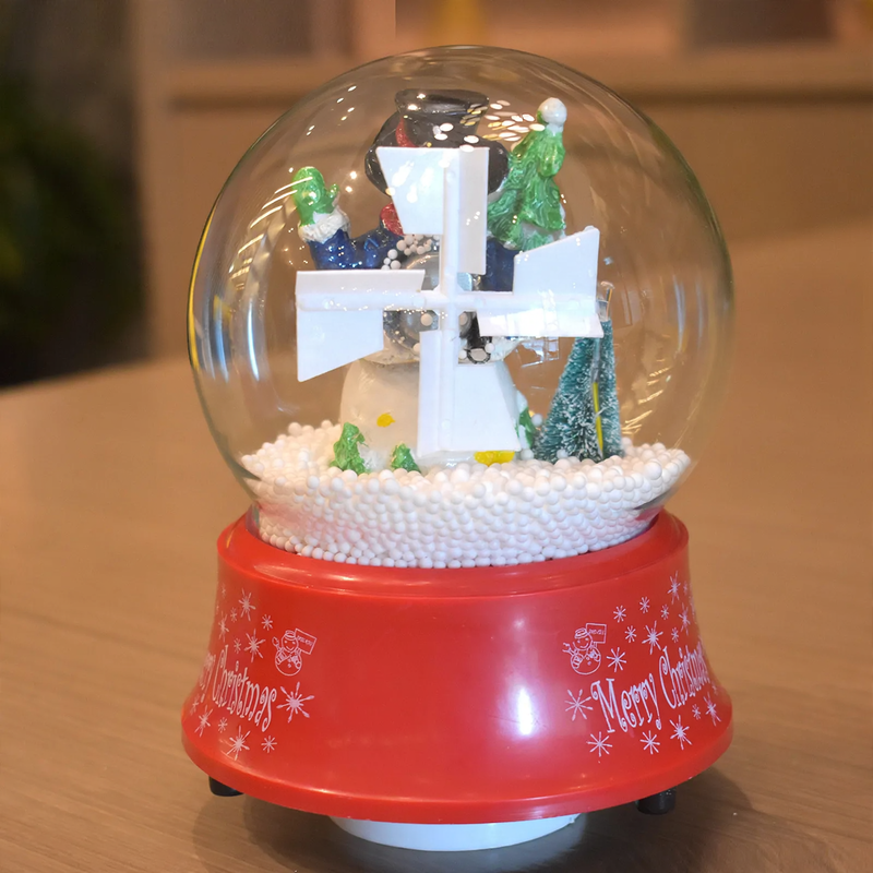 Weihnachtliche Spieluhr mit Schneekugel-Effekt