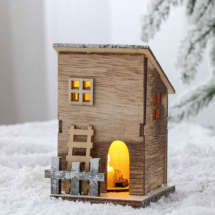 Beleuchtetes Holz-Weihnachtshaus im skandinavischen Stil