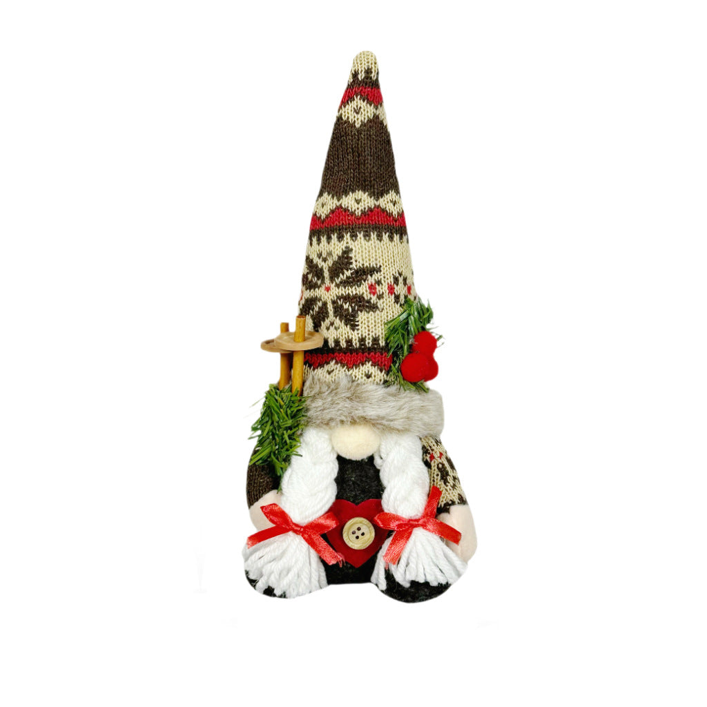 Weihnachts-Wichtelfigur mit Strickmütze und Tannenzweig