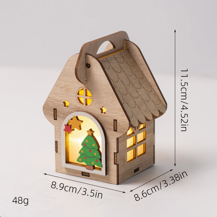 Beleuchtetes Holzhaus als Weihnachtsdekoration