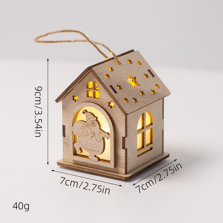 Beleuchtetes Holzhaus als Weihnachtsdekoration