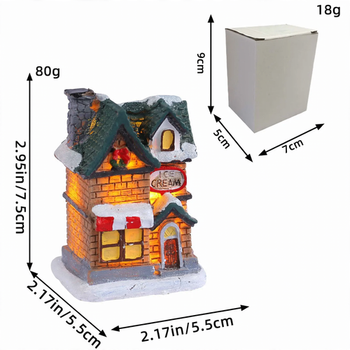 Beleuchtetes Miniatur-Weihnachtshaus mit Schneelandschaft