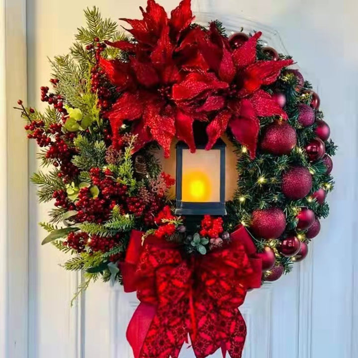 Weihnachtskranz mit dekorativer Öllampe und Blumen