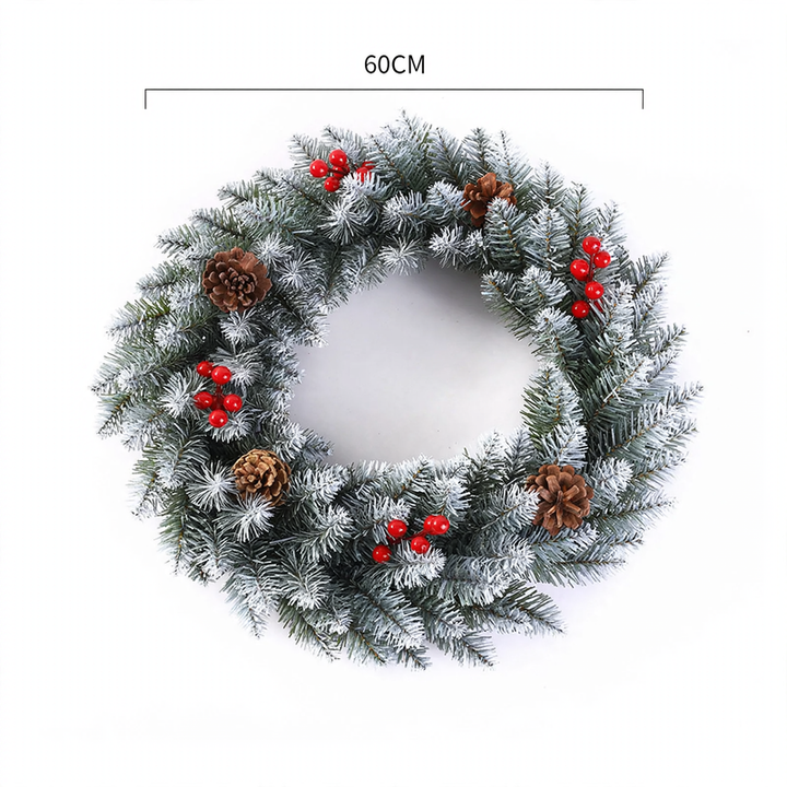Weihnachtskranz mit Beeren und Tannenzapfen