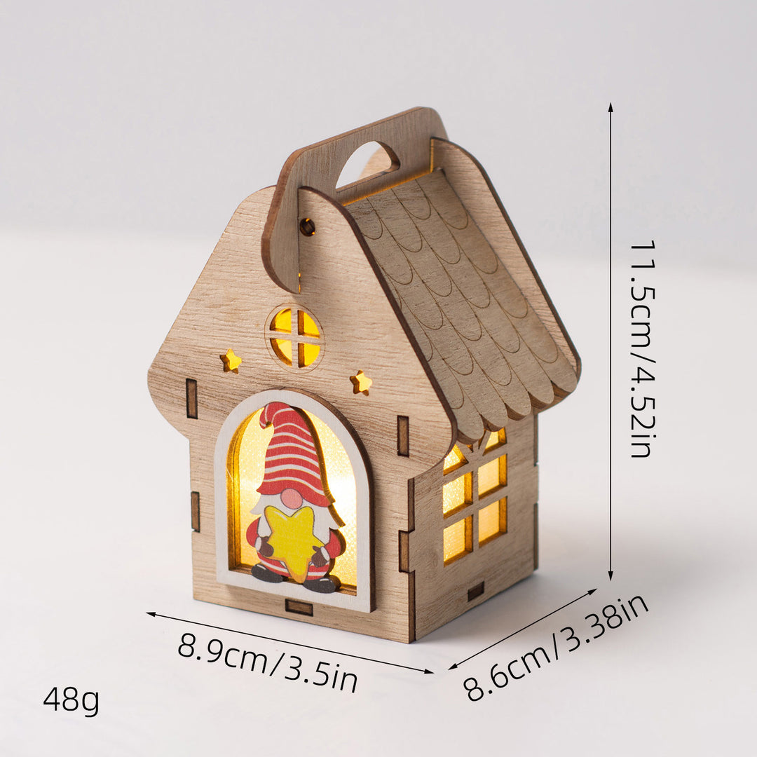 Beleuchtetes Holzhaus als Weihnachtsdekoration