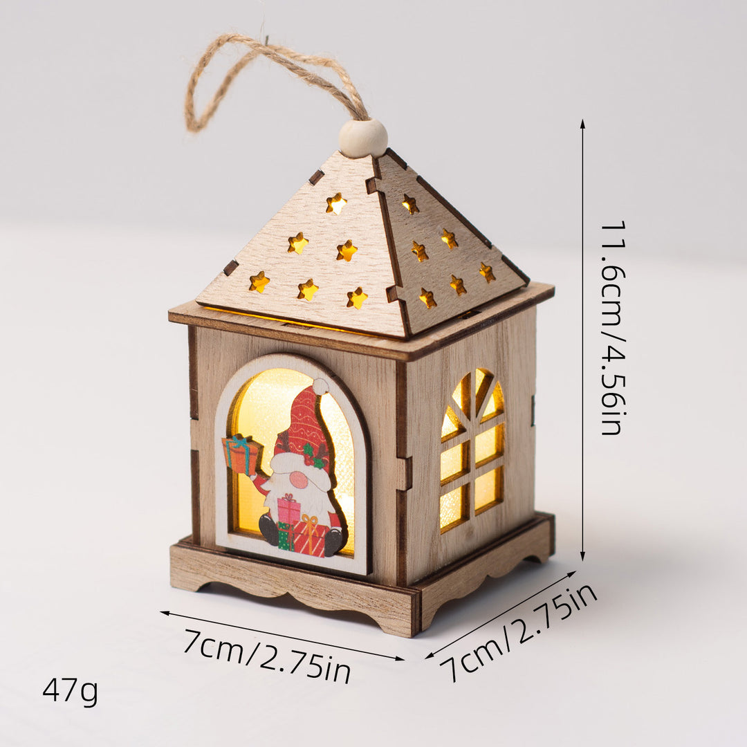 Beleuchtetes Holzhaus als Weihnachtsdekoration