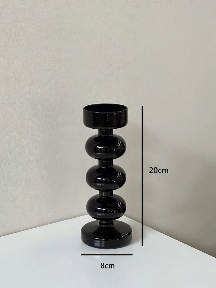 Dekorativer Kerzenhalter aus Glas und Holz