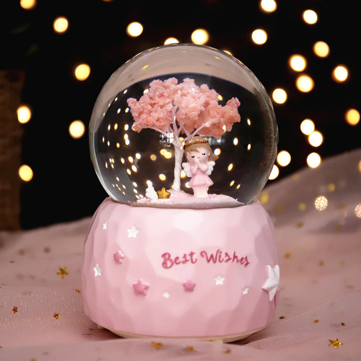 Märchenhafte Schneekugel mit Musik und Licht
