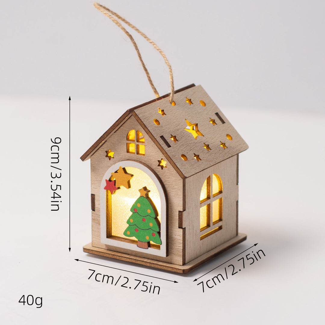 Beleuchtetes Holzhaus als Weihnachtsdekoration