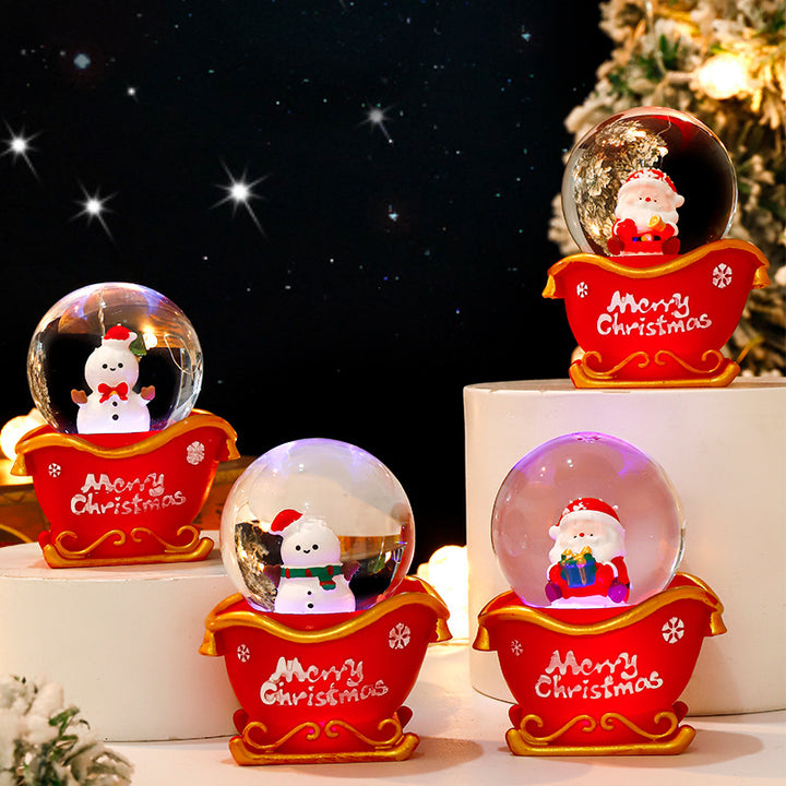 Weihnachtliche Schneekugel mit Beleuchtung und Schneeeffekt
