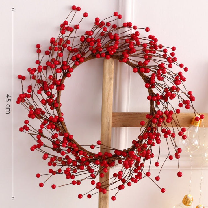 Weihnachtskranz mit roten Beeren