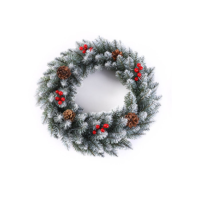 Weihnachtskranz mit Beeren und Tannenzapfen