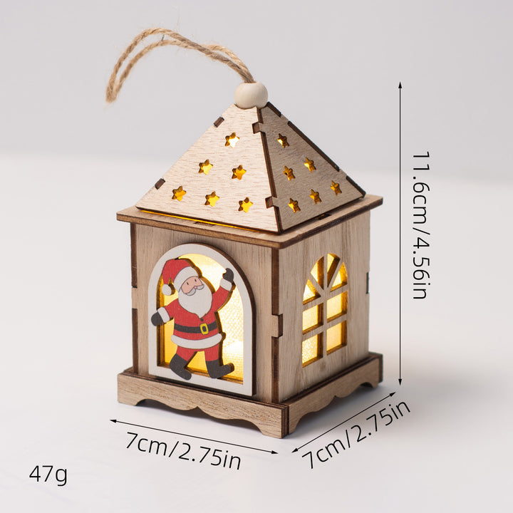 Beleuchtetes Holzhaus als Weihnachtsdekoration
