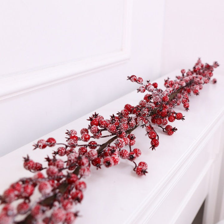 Weihnachtskranz mit roten Beeren
