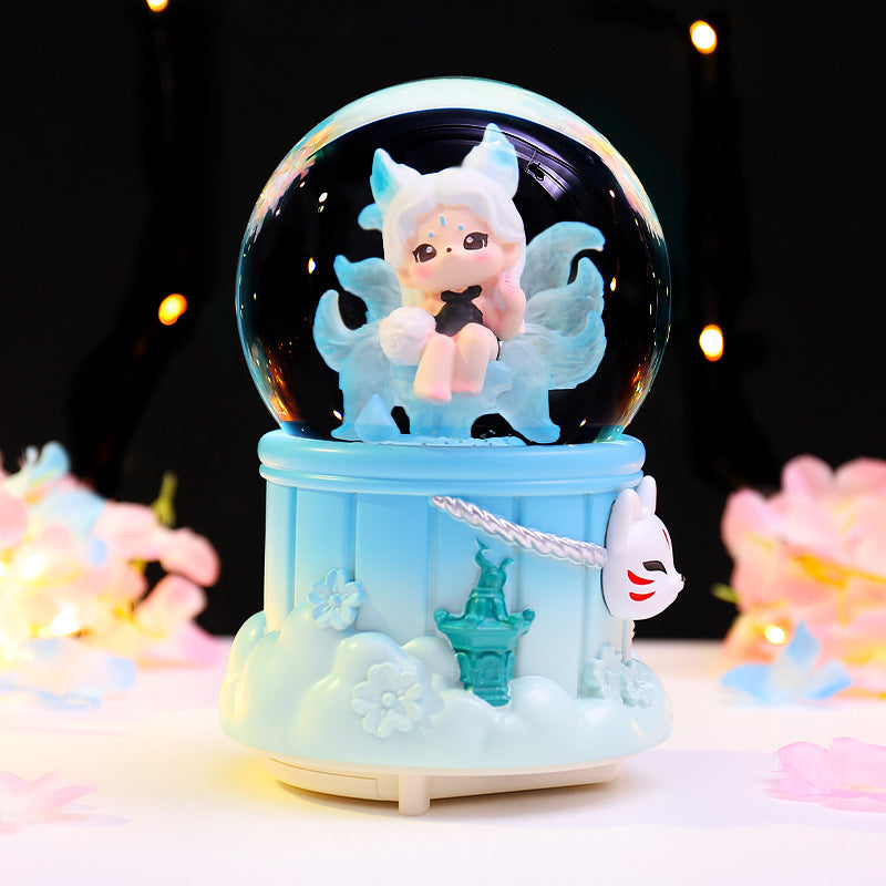 Märchenhafte Schneekugel mit Musik und Licht