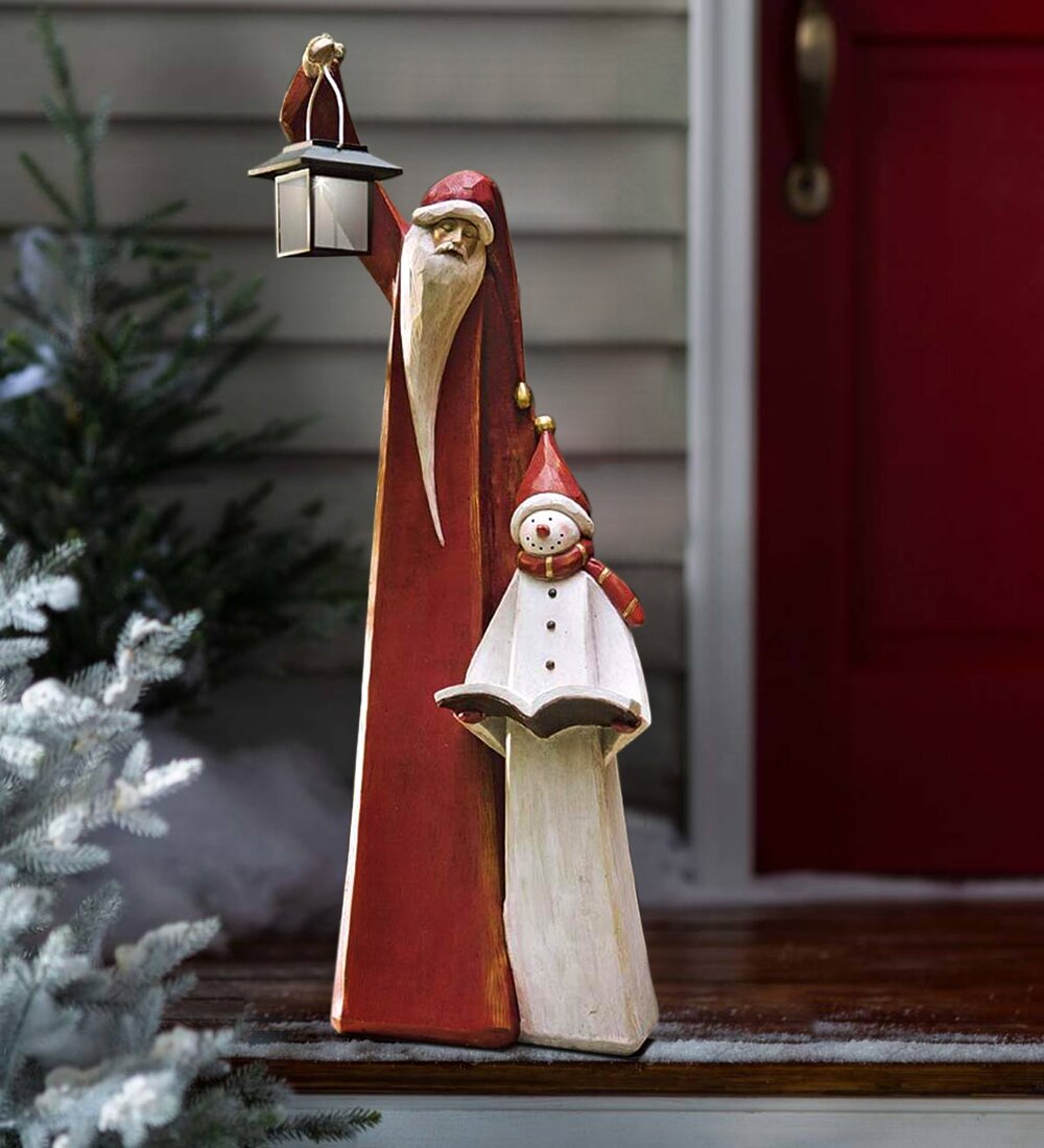 Weihnachtsmann- und Schneemann-Skulptur