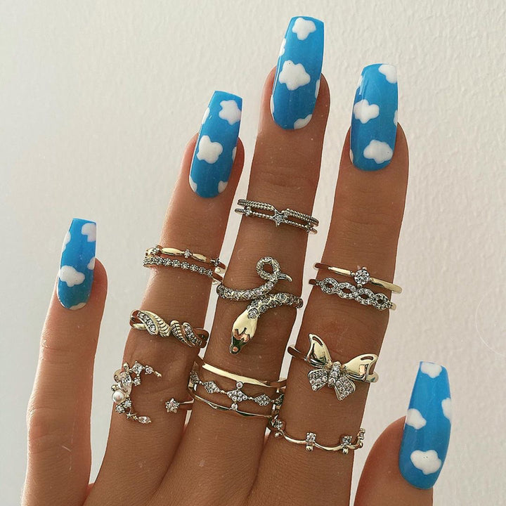 Exquisite Kunstnägel mit Wolkenmotiv und Glanz Karnz