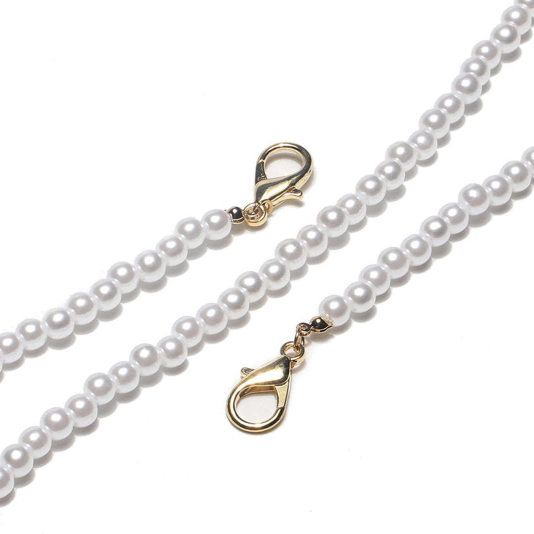 Elegante mit Perlenakzenten versehene Brillenhalterung Karnz