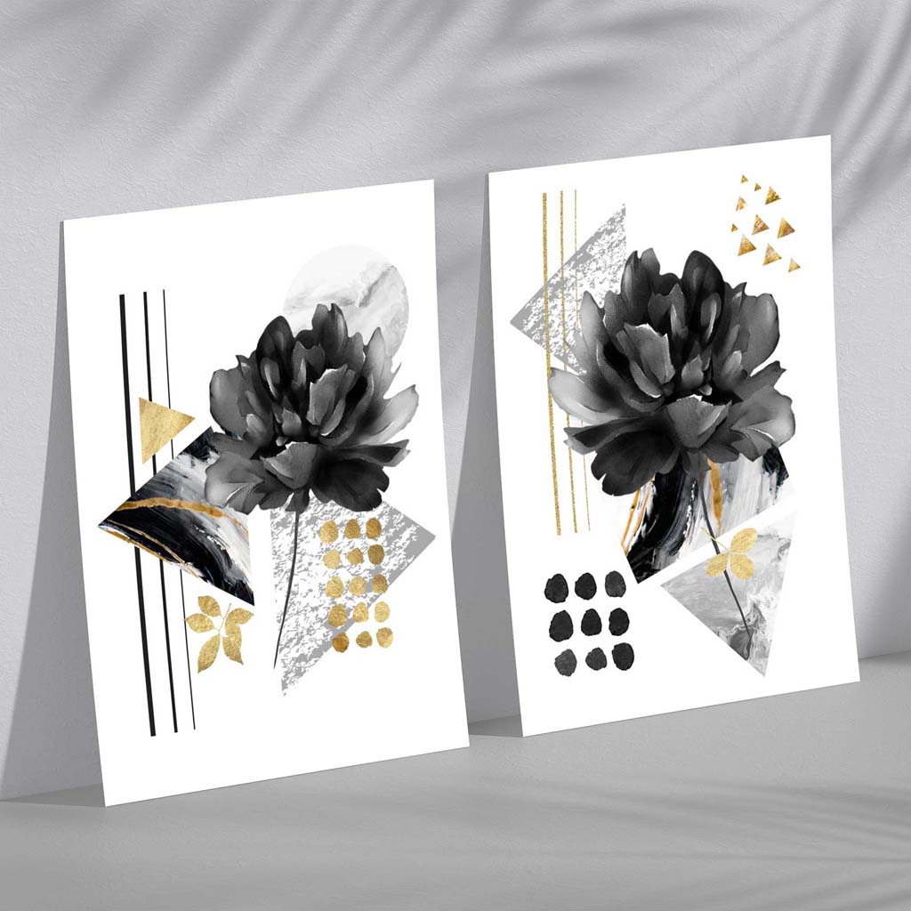 Moderne Blumenmotive, schwarz-gold gerahmtes Set aus 2 Kunstdrucken