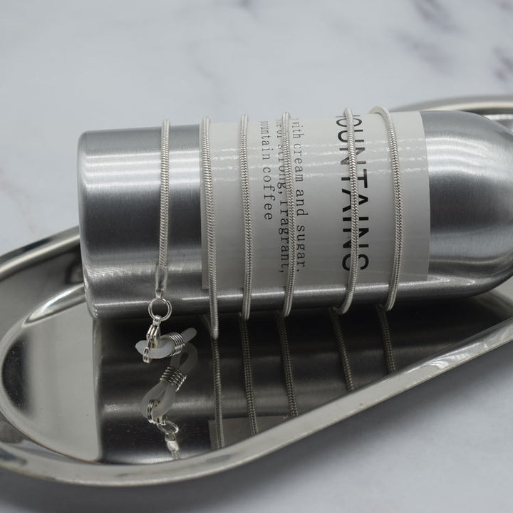 Schlanker Brillenhalter aus Edelstahl Karnz