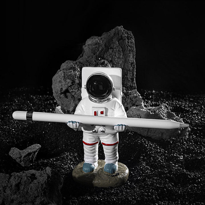 Unterstützung für Mobiltelefon oder Stift in Astronautendekorationen | Karnz